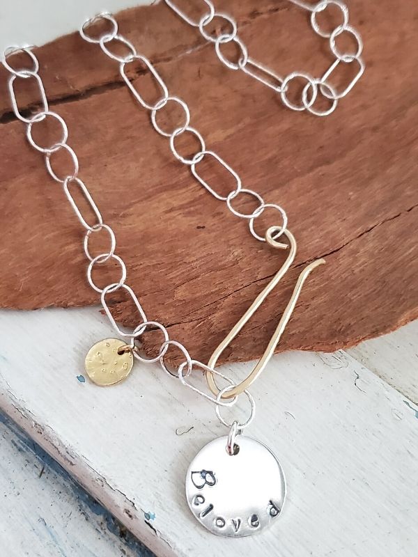 sterling chain beloved charm necklace on wood