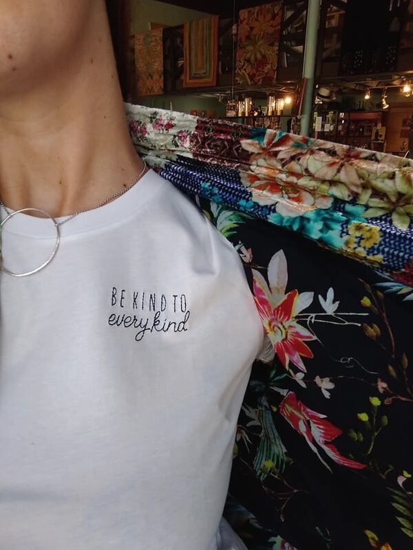 tee shirt being worn with circle necklace