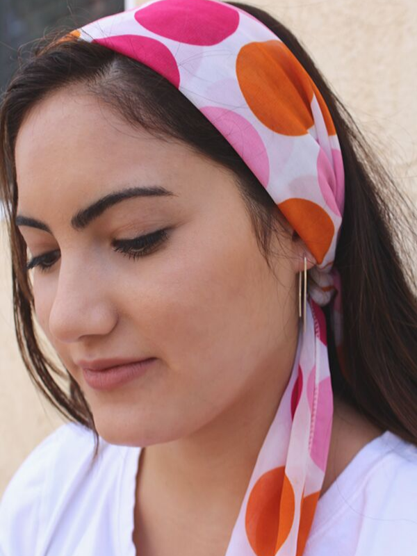 polka dot scarf on model with arc earrings