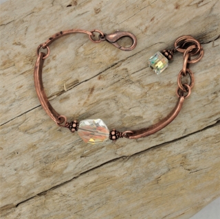 Artisan style copper Swarovski crystal bracelet on wood