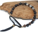 men's-black-leather-brown-wood-black-lava-bead-bracelet-on-brown-wood