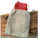 tan-linen-jewelry-bag-with red-burlap-on-wood-background