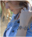 Bronze-wildflower-clear-Swarovski-crystal-statement bracelet-on-model