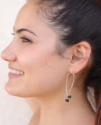 sterling arc earrings on female profile
