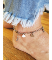 blue jeans and silver heart anklet on foot