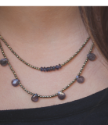 blue gold beaded layered leather necklace on neck