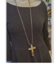 big-brass-cross-statement-necklace-on-black dress