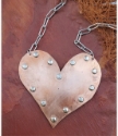 copper heart statement necklace with rivets and silver chain