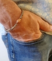Beaded stretch neutral bracelet worn by male with jeans