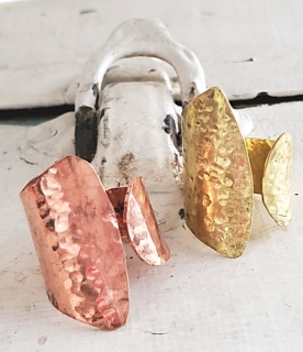 wide wrap rings hammered in copper & brass on distressed white background