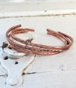 casual copper cuff stack on distressed white wood