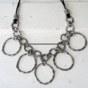 casual silver chain cluster necklace on white distressed wood