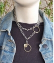Layered chunky chain mixed metal necklace with black top & jean jacket