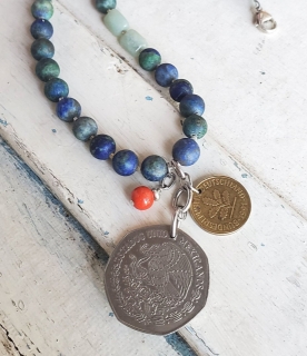 Double coin necklace with blue red gemstones close up