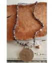 Full view Jamaica coin pearl necklace on wood