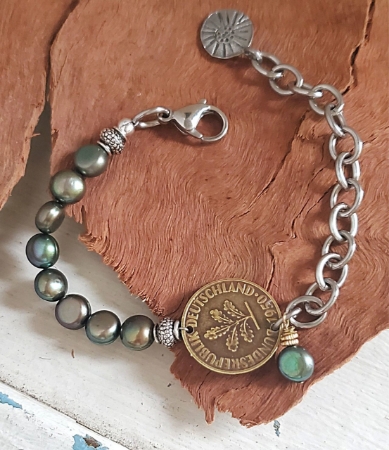 Green pearl chunky chain old coin bracelet on wood