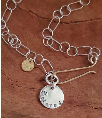 Beloved Charm silver & gold necklace on wood