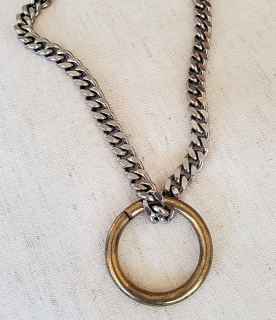 brass ring thick silver curb chain necklace on white background