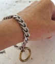 big silver chain gold oring  dangle bracelet on wrist