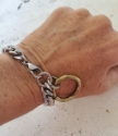  silver chain gold oring bracelet on wrist