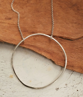 Silver chain open circle necklace on wood
