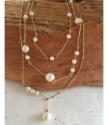 gold chain white pearl drop layered necklaces  on wood