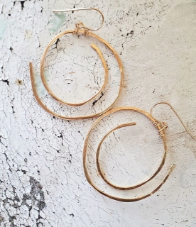 big gold spiral earrings on white