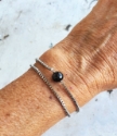 black gemstone silver box chain double strand bracelet on arm