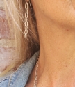 long silver chain earrings on female