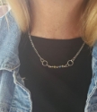 silver chain crystal bar modern necklace on model in denim