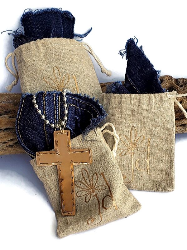 cross statement necklace in jewelry bags with denim