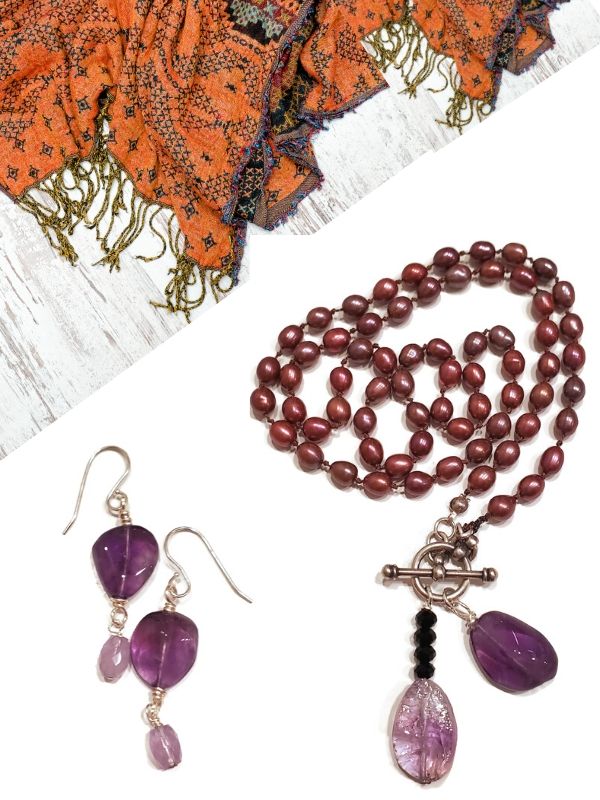 purple gemstone jewelry with orange scarf
