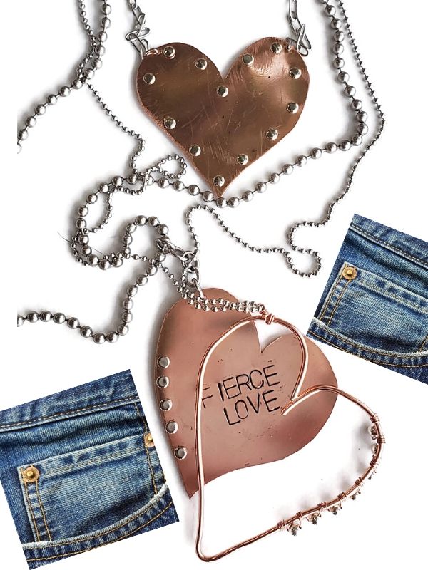 an assortment of riveted metal heart necklaces