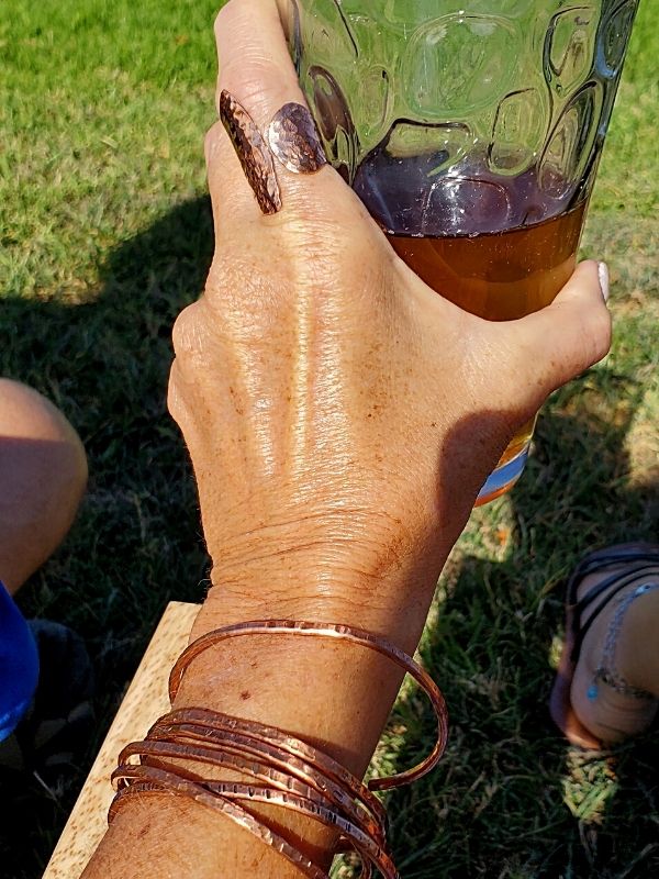 wearing copper jewelry with ice tea