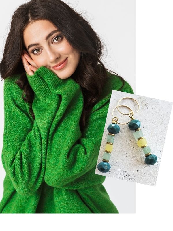 green earrings and model wearing green sweater