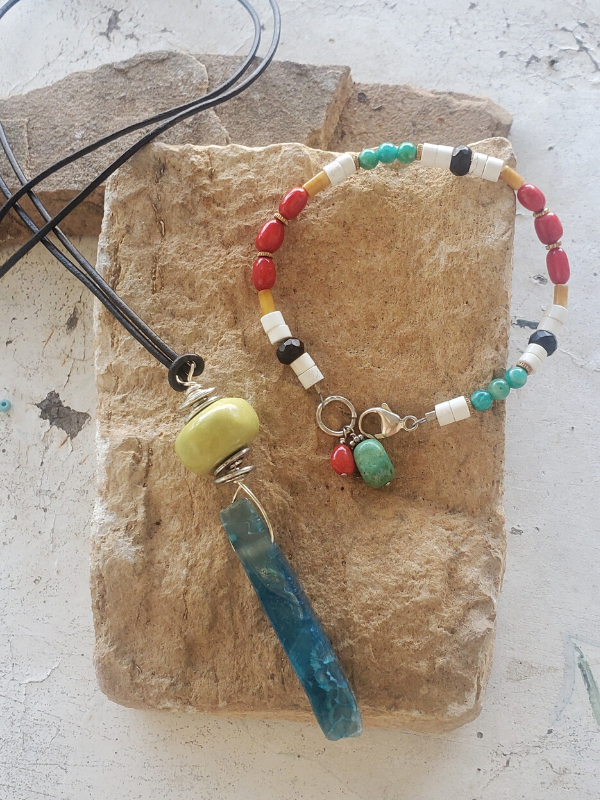 bright color earthy gemstone jewelry on rock